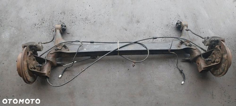 BELKA OŚ ZAWIESZENIA TYŁ TARCZE Z ABS TOYOTA COROLLA VERSO II - 1