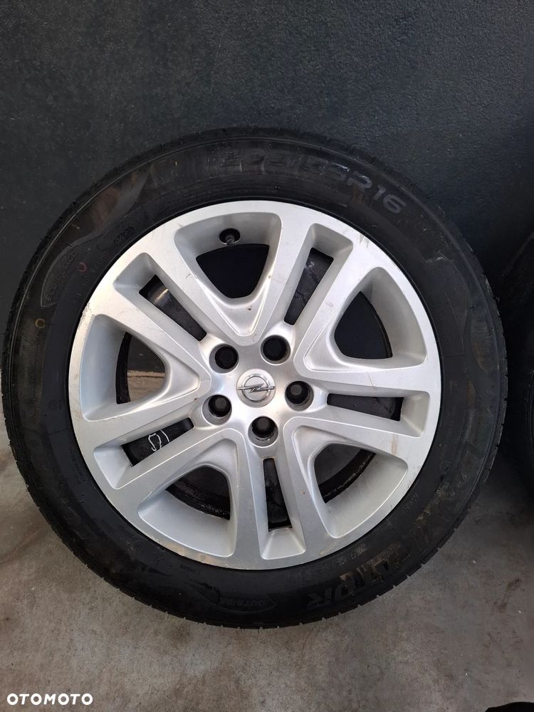 Felgi z kołpakami nowe opony Opel Astra K 5x105 - 5