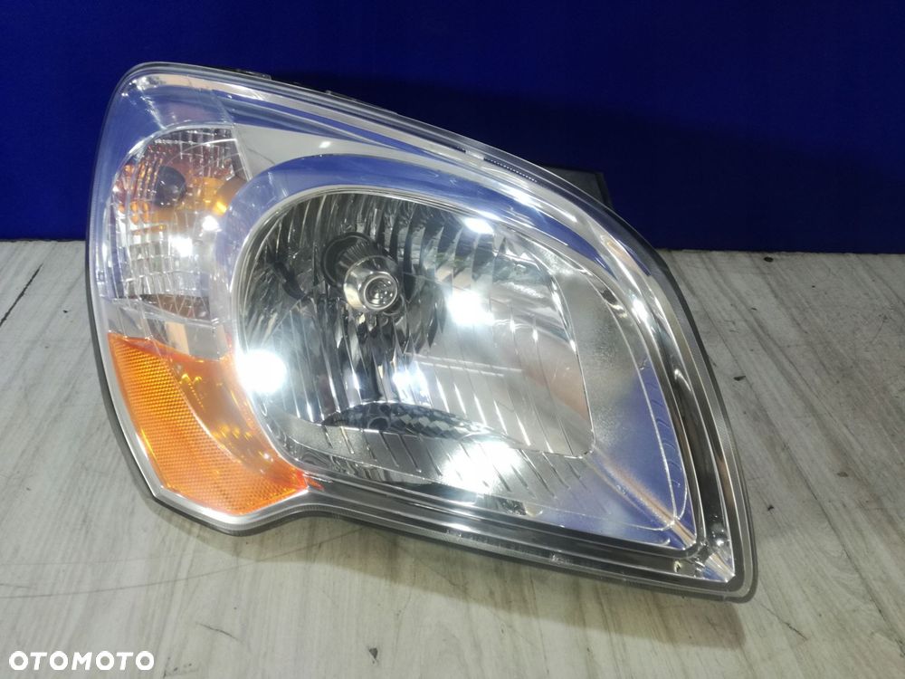 kia sportage ii lift lampa reflektor prawa anglik 07/10 - 1