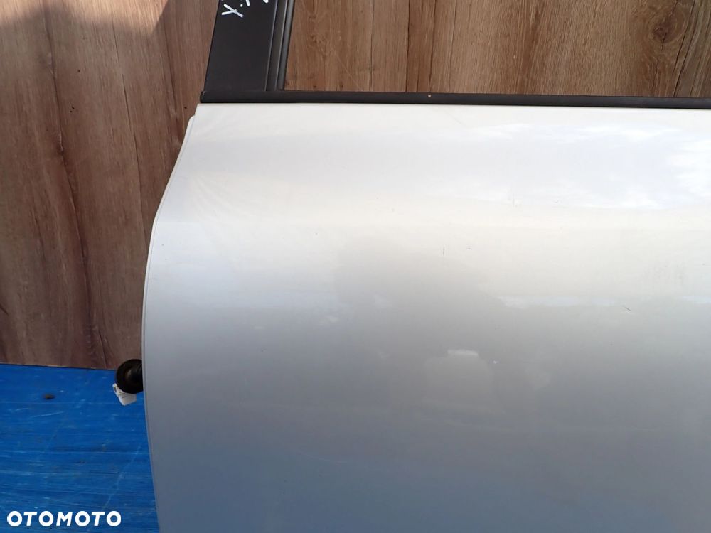 TOYOTA YARIS II 06-11 5d DRZWI TYLNE LEWE 1E7 - 9