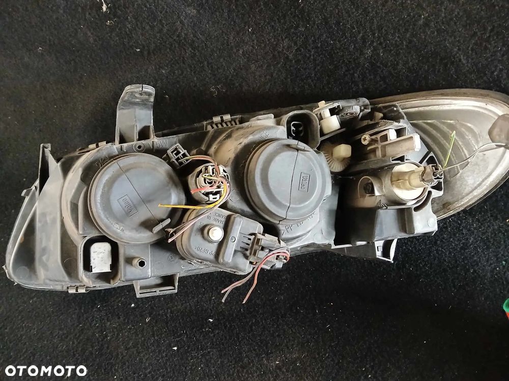 Nissan Almera II N16 lampa przednia lewa - 4