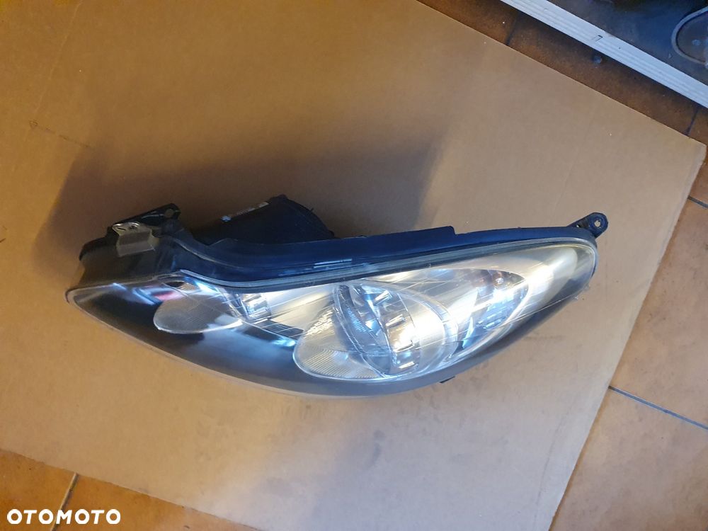 REFLEKTOR LEWY OPEL CORSA D CZARNY ŚRODEK - 3