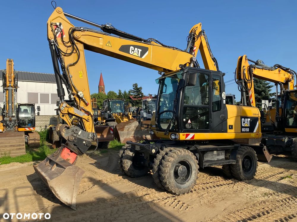 Caterpillar CAT M315D, 7000 MTH, 2014 ROK, Z NIEMIEC, SUPER STAN - 1