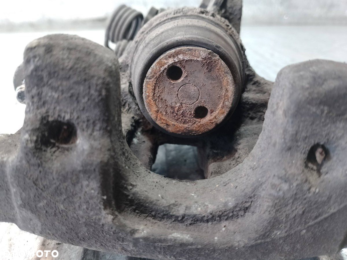 ZACISK HAMULCOWY PRAWY TYŁ NISSAN PRIMERA P12 1.9 - 2