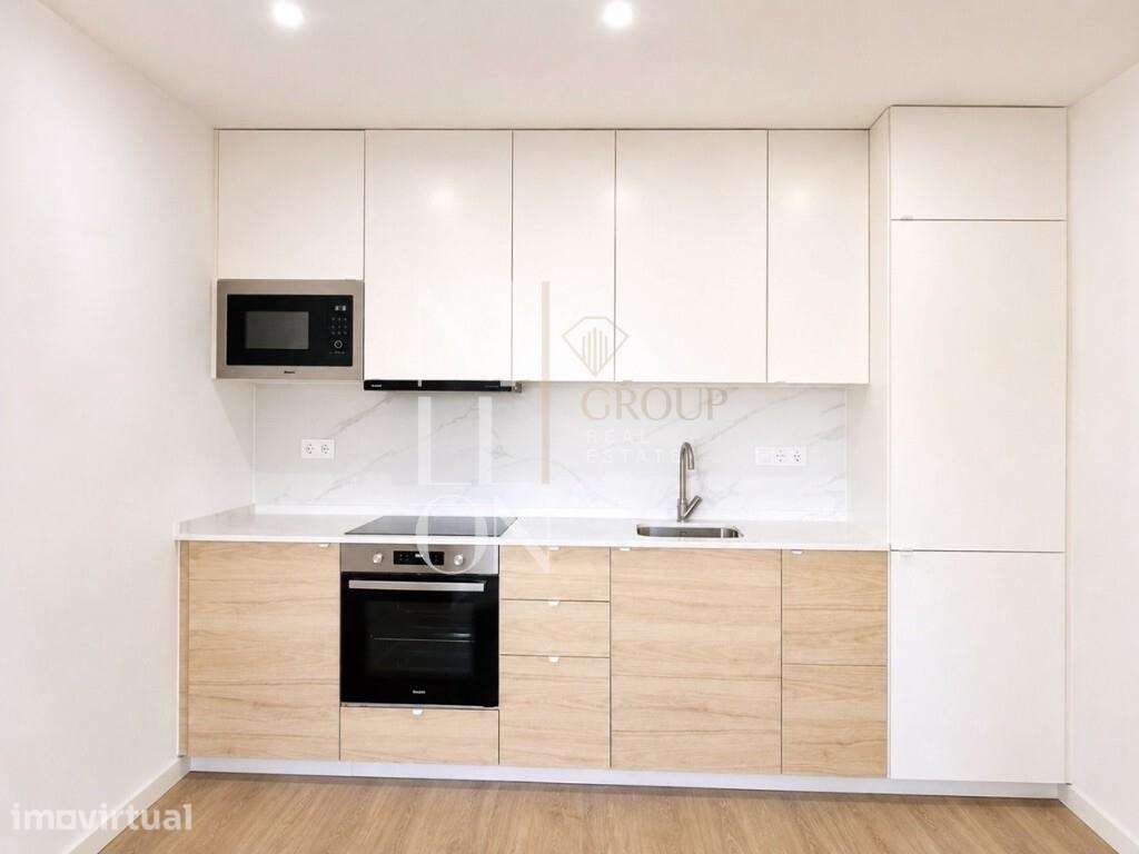 T1 pronto a habitar com cozinha equipada, varanda e elevador na Amador - Grande imagem: 2/13