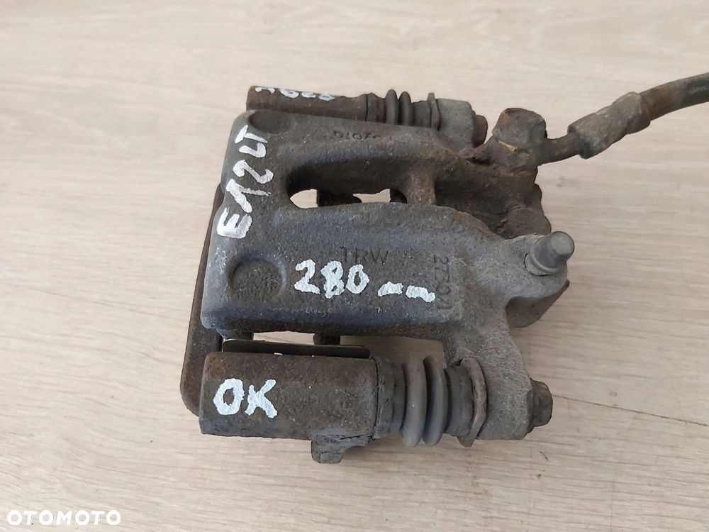 Toyota Corolla E12 zacisk jarzmo tył lewy TRW 275mm - 3