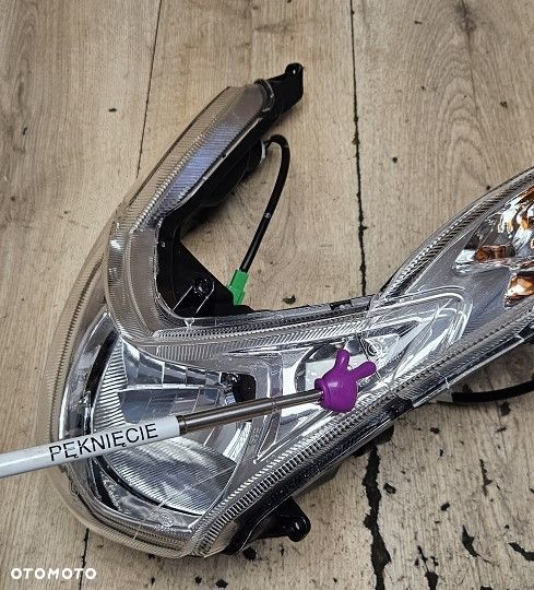 Reflektor lampa Peugeot Kisbee Streetzone - 11