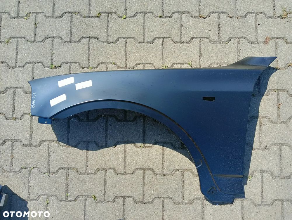 BMW X3 e83 2004-2010 lewy blotnik przedni - 1