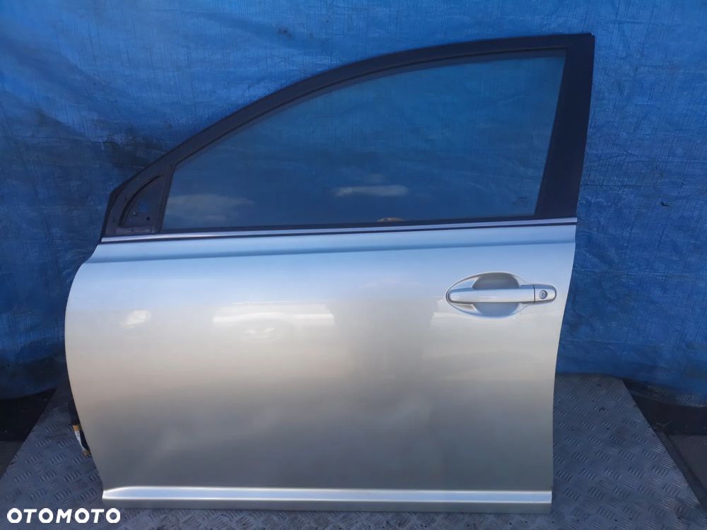 DRZWI LEWY PRZÓD TOYOTA AVENSIS II T25 LIFT 2007r  KOLOR: 1C0 - 1