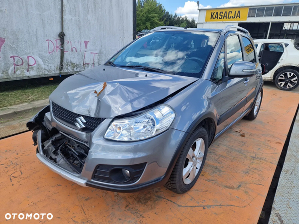 Suzuki SX4 2006/06- Silnik 1.6 VVT M16A107KM/79kW ZCD na części drzwi lampa lusterko