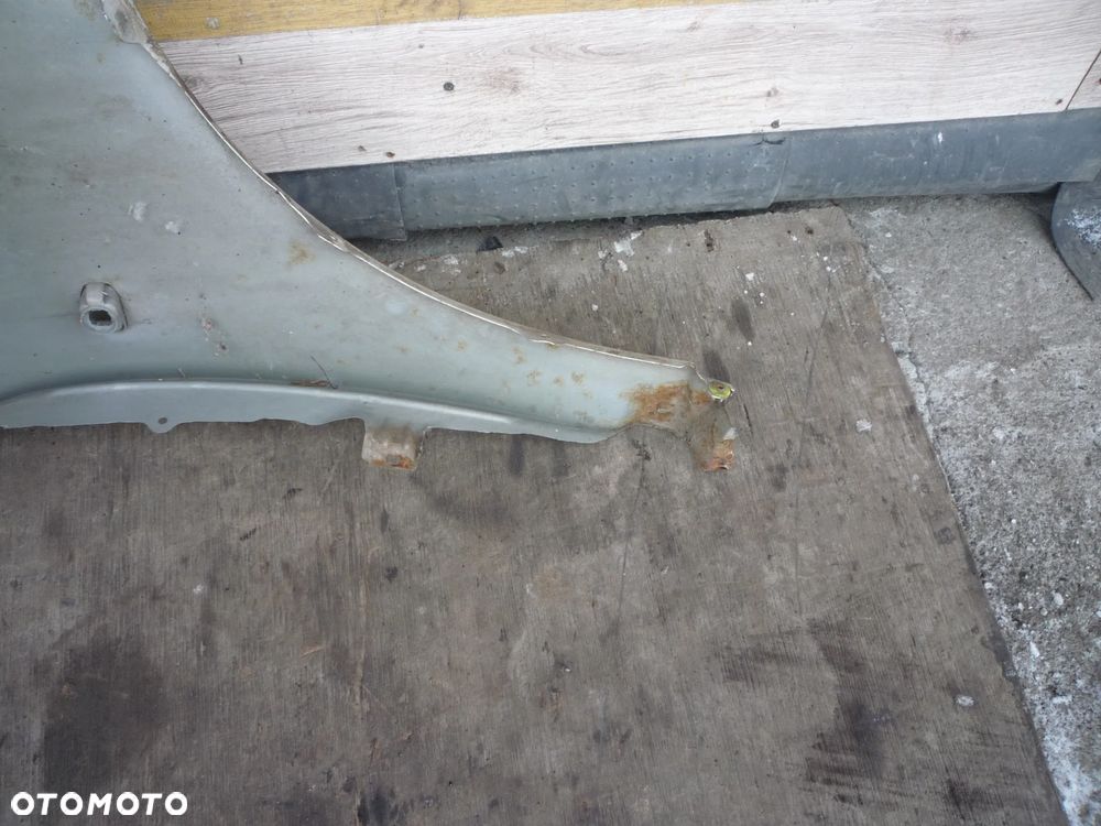 TOYOTA AVENSIS T25 BŁOTNIK LEWY 1C0 - 4