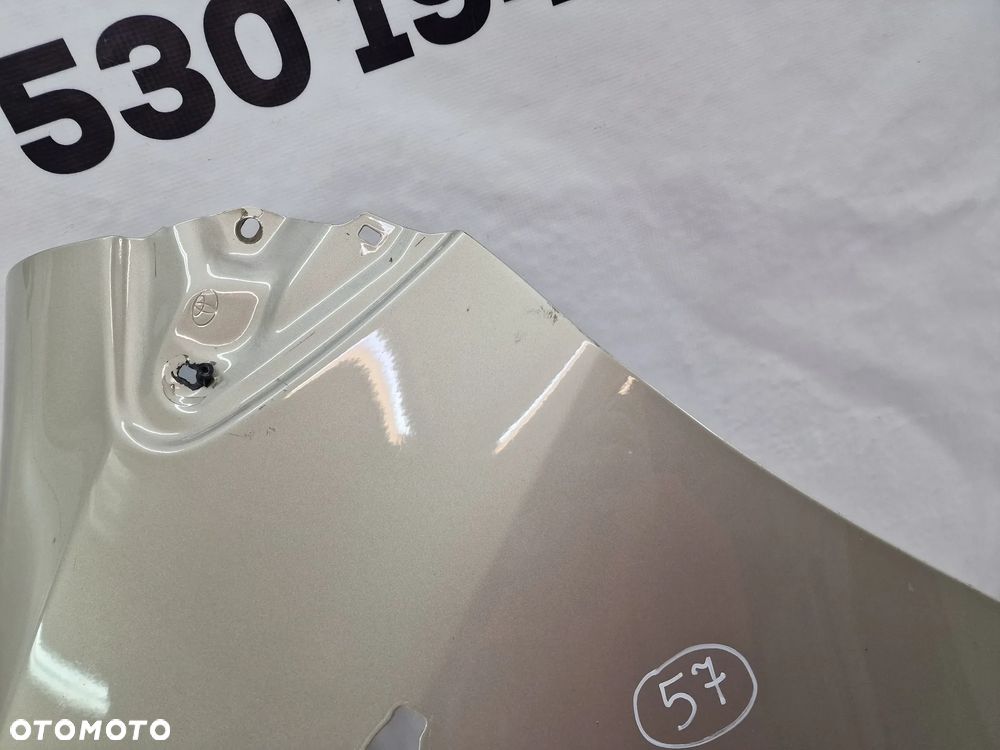 TOYOTA YARIS II LIFT 09-11 LEWY ŁADNY BŁOTNIK PRZEDNI PRZÓD , BEŻOWY METALIK , NR AUKCJI BŁ57 - 7