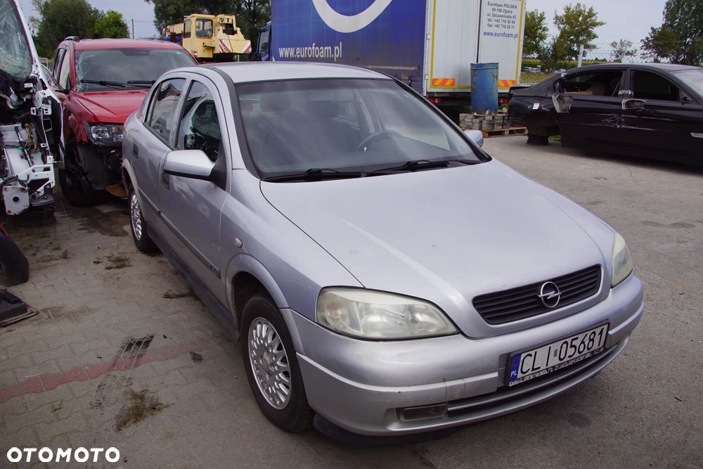 Auto na części - Opel Astra II G 1.6 16V 101 KM X16XEL F17 Z147 1999R Silnik Skrzynia Drzwi Maska Błotnik Zderzak Klapa Lampa Lusterko Klamka Szyba Deska Kokpit Sterownik Moduł Czujnik Licznik Panel Kierownica - 7