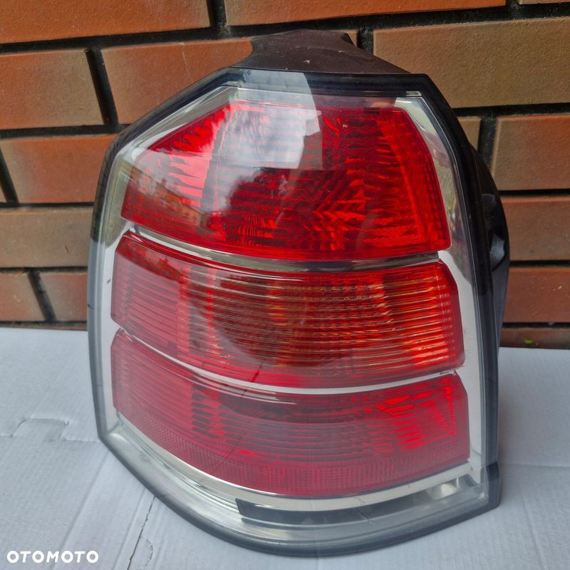 LAMPA TYŁ TYLNA OPEL ZAFIRA B EUROPA LEWA13252447 - 1