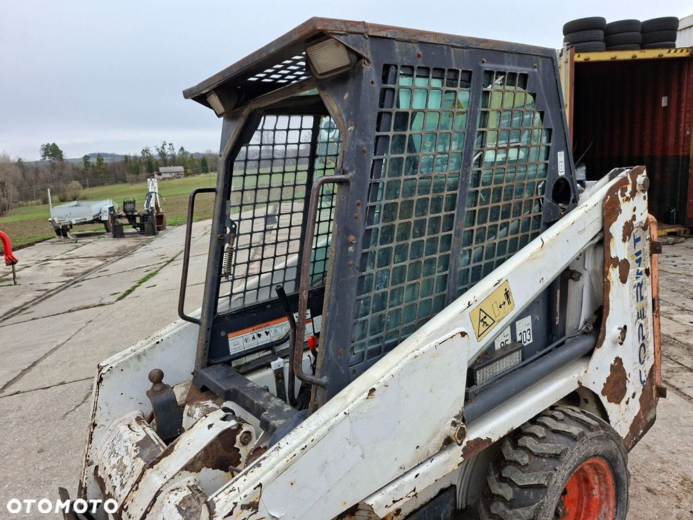 Bobcat 553 4X4 + Melroe Ingersoll-Rand 725S B/H - 35