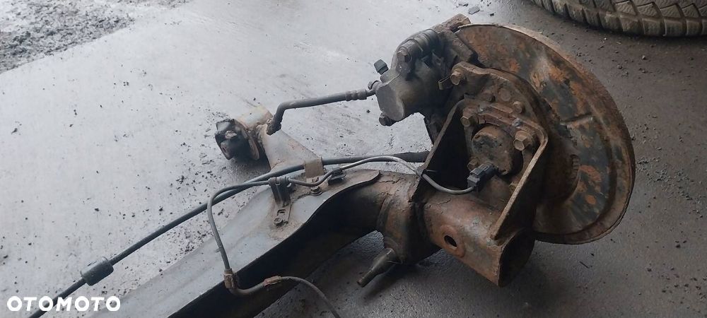 BELKA OŚ ZAWIESZENIA TYŁ TARCZE Z ABS TOYOTA COROLLA VERSO II - 2