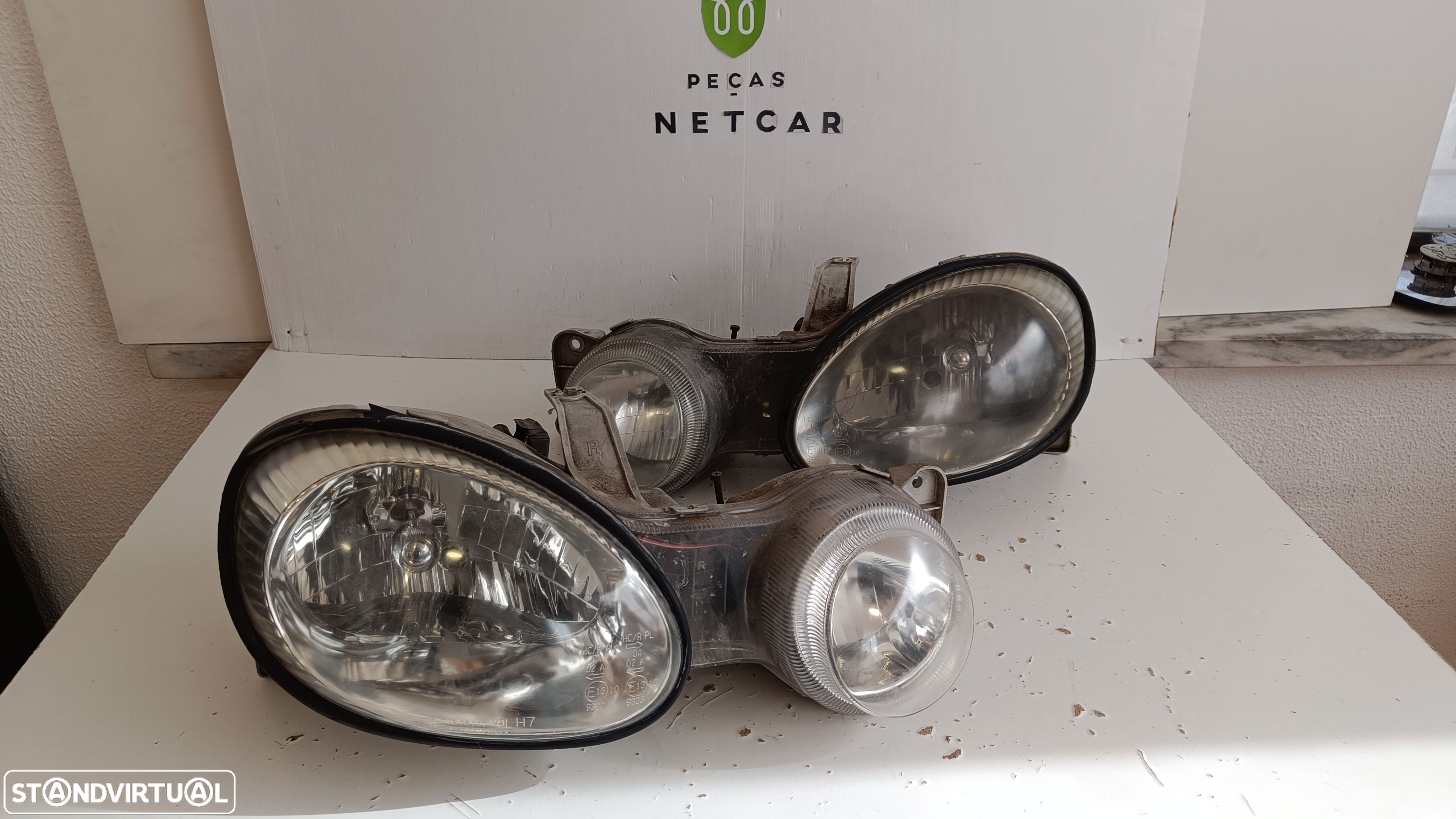 farol óptica Kia shuma 2000 - 1