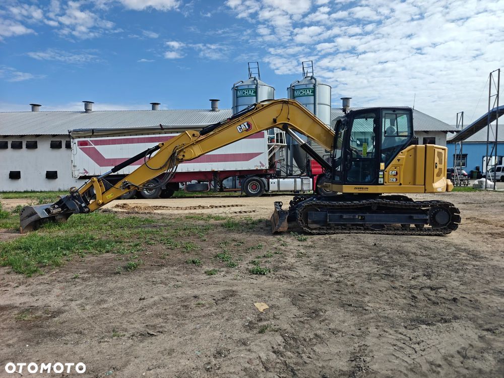 Caterpillar 310 - 10