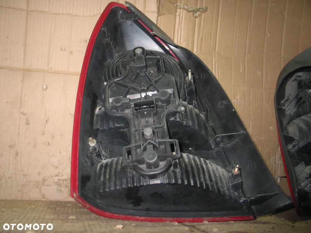 lampa tyl prawa lewa nissan primera P12 sedan oryginal - 11
