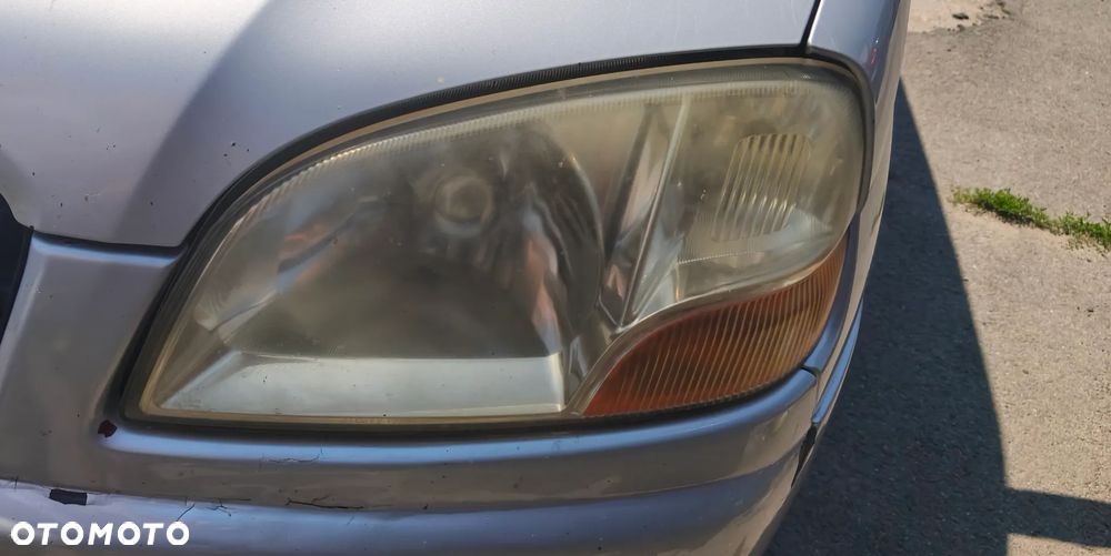 SUZUKI IGNIS I 02r LAMPA LEWY PRZÓD PRZEDNIA EUROPA - 1