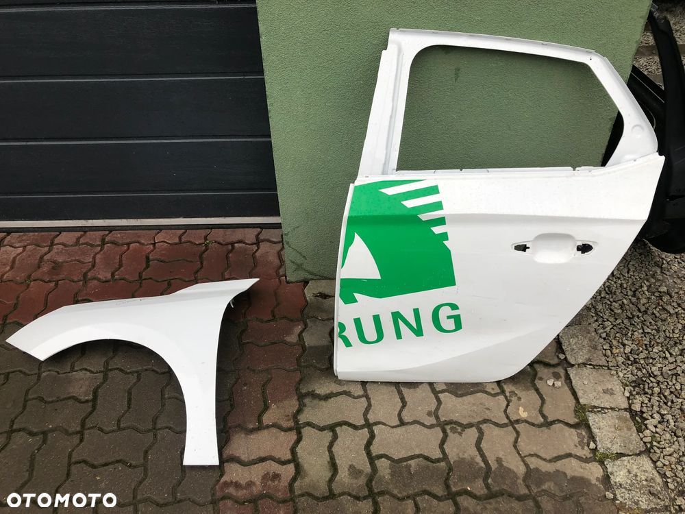 blotnik prawy przedni Opel Corsa F rok 19- - 4