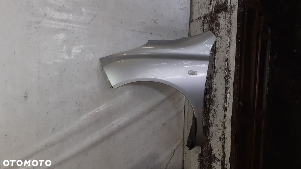 *NISSAN MICRA K12 BŁOTNIK PRZÓD PRZEDNI LEWY KY0 SREBRNY - 1
