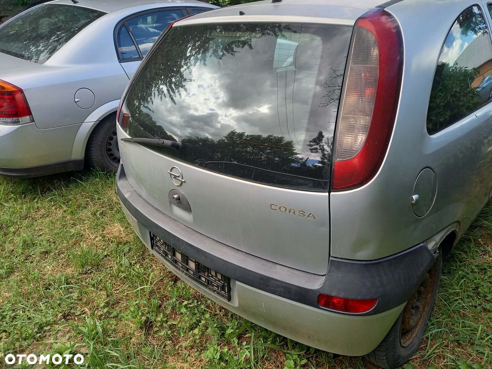 części OPEL CORSA C hatchback 3drzwi 1.0 benzyna 2002r. Srebrny LAMPY tył prawa lewa - 1