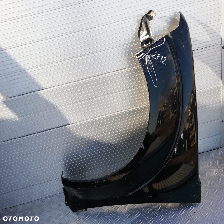 E772 LEWY BŁOTNIK NISSAN NAVARA 2008- - 1