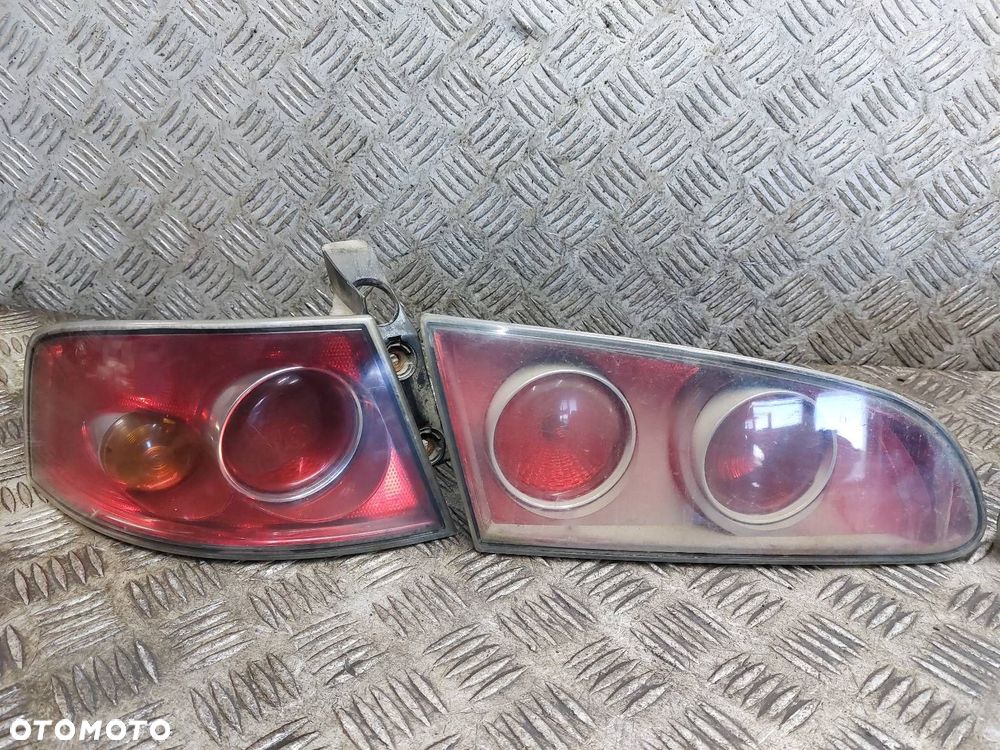 LAMPA LEWY TYŁ + PRAWY TYŁ W KLAPĘ W BŁOTNIK KOMPLET SEAT IBIZA III - 2