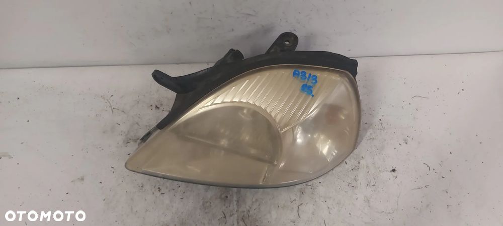 .  PRZOD PRZEDNIA LAMPA LEWA KIA RIO 1 - 2