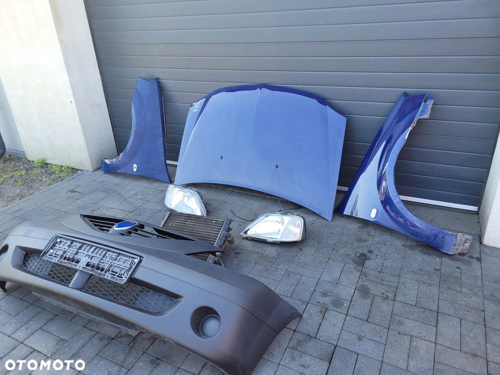Dacia Logan I 04-08 1.4 Zestaw maska lampy blotniki chlodnica zderzak - 2