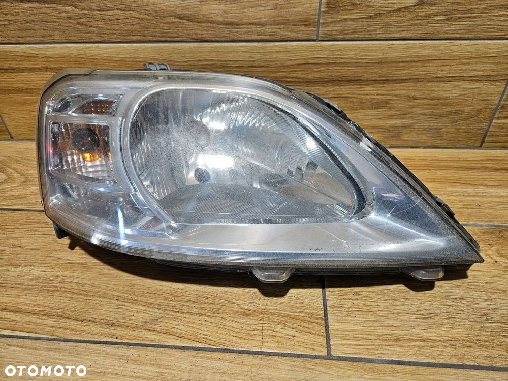 Dacia Logan I LIFT 08-12 Lampa przednia prawa prawy przód 8200744754