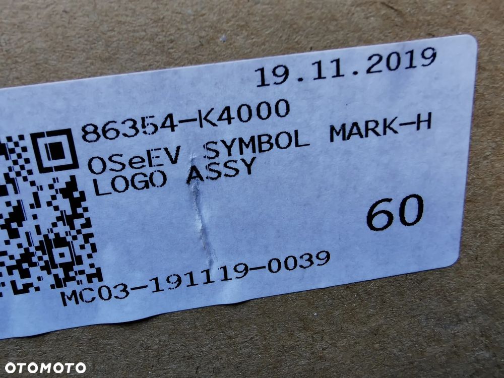 Hyundai Kona EV Emblemat znaczek logo przód 16x8cm 86354-4000 - 2