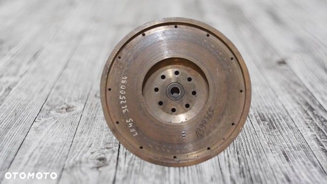 KOŁO ZAMACHOWE DAF 45 LF 4,5L 180 KM EURO 5 , 4 CYLINDRY - 1