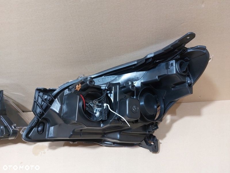 OPEL ASTRA H III 07-12 Reflektor lampa GTC CIEMNA - 8