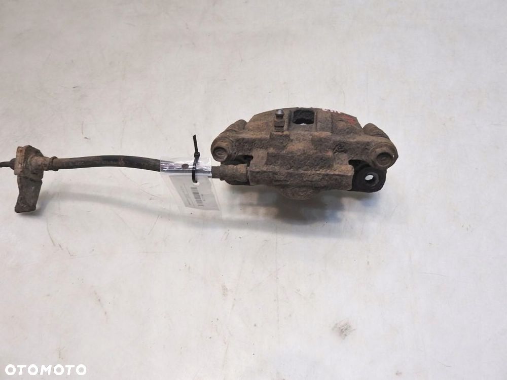 ZACISK HAMULCOWY PRAWY TYŁ MITSUBISHI LANCER VIII 1.8 - 3