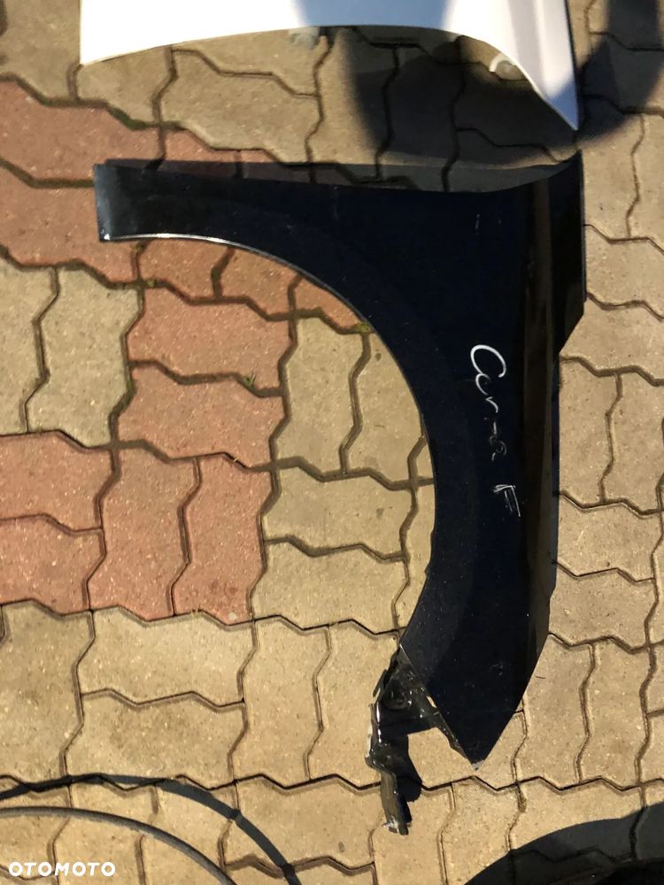 blotnik prawy przedni Opel Corsa F rok 19-