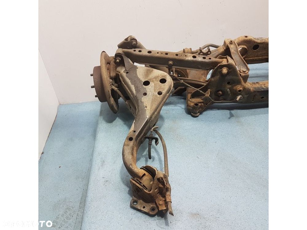 NISSAN QASHQAI I LIFT 2.0B BELKA ZAWIESZENIA TYŁ - 8