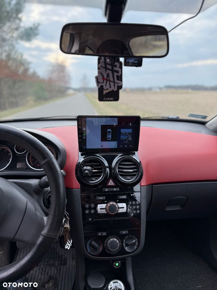 Opel Corsa 1.4 16V Cosmo - 11