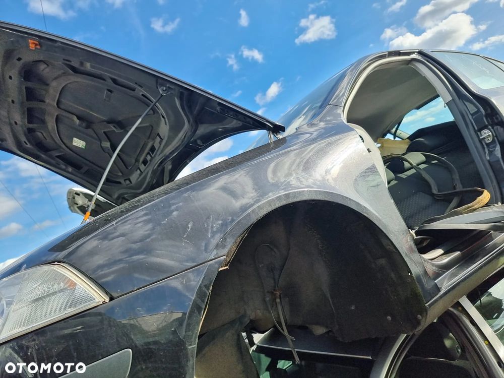 BŁOTNIK LEWY PRZÓD PRZEDNI SKODA OCTAVIA II 9910 - 1