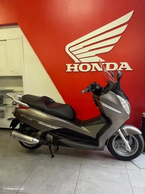 Honda SW-T S WING - 125  4 TEMPOS - 1