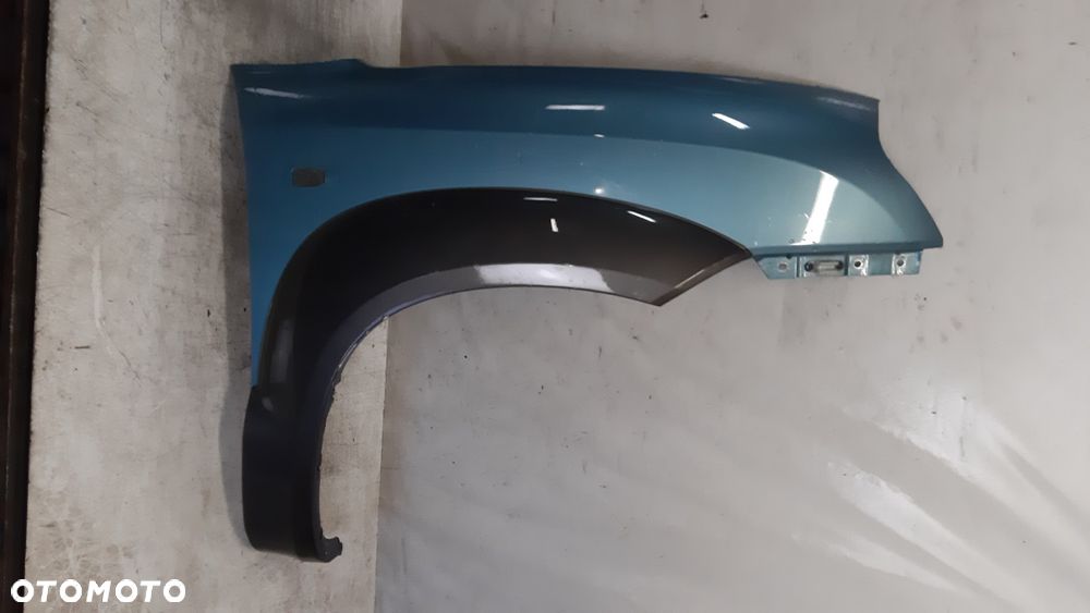 * Hyundai Tucson I 1 błotnik PRAWY  przedni przód MORSKI KOLOR HE - 1