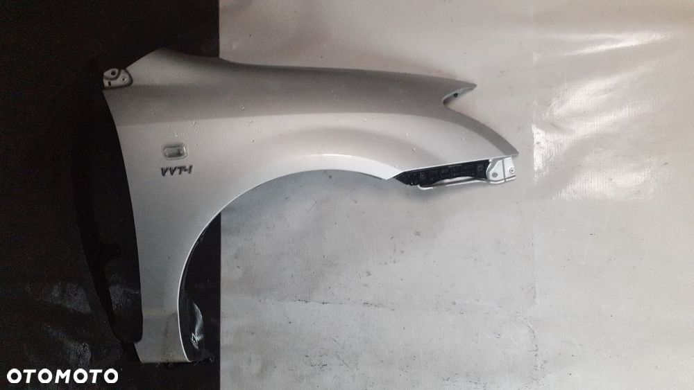* TOYOTA COROLLA E12 BŁOTNIK PRZEDNI PRAWA 199 SREBRNY - 1