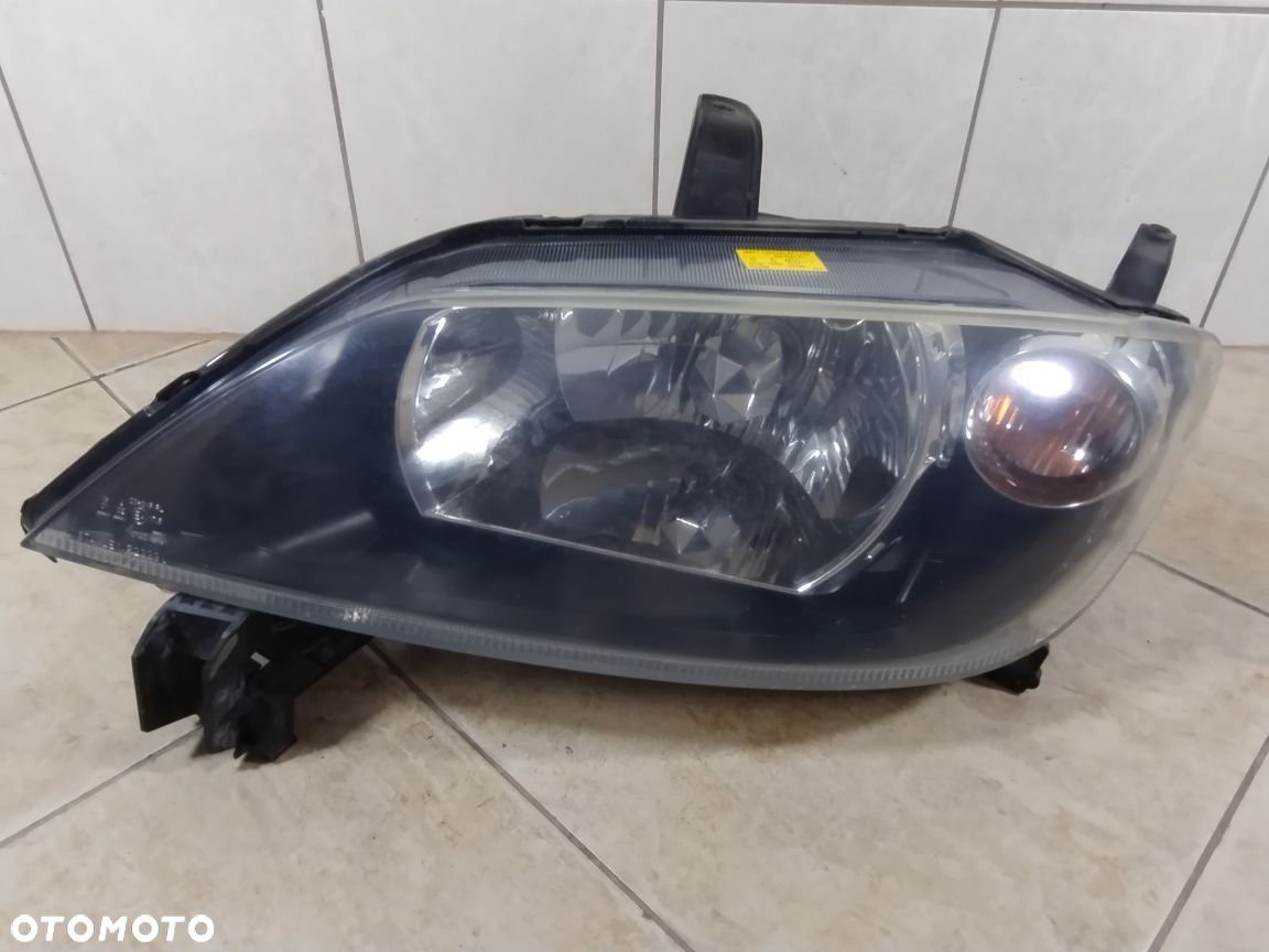 Lampa reflektor Europa lewy przód Mazda 2 II oryginał wysyłka - 1
