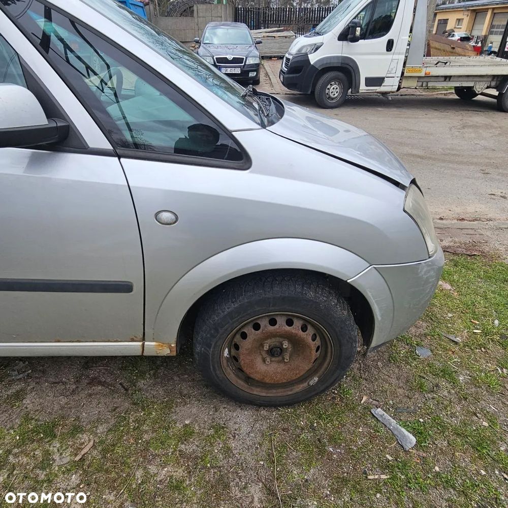 BŁOTNIK BŁOTNILI / PRAWY LEWY /  OPEL MERIVA (2004r) kod lak: Z157 - 2