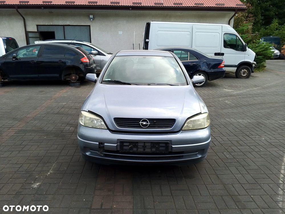 Opel Astra G (04r.) 2.0 HDI 89KM. Silnik Z14XE Skrzynia MG4 lakier 163 / 4AU / GBJ - SILVER LIGHTNING.Cały na części. GWARANCJA !!!  Przód Tył Zestaw Komplet Drzwi Klapa Zderzak Błotnik Maska Grill Atrapa Szyba Pas Lampa Lusterko Boczki Fotel Kanapa Kokpit Deska Rozdzielcza Przełącznik Włącznik Sterownik Przewody Wiązka Instalacja Moduł Komputer Czujnik Listwa Pompa Alternator Wtryski Głowica Rozrusznik Kompresor Sprzęgło Dwumas Silnik Skrzynia ABS Klimatyzacji Paliwa Wspomagania Kolektor Turbina Przepustnica Zawór Chłodnica Koło Hak Belka Sanki Zawieszenie Mcpherson Półoś Amortyzator Wydech Tłumik Zacisk Most - 3