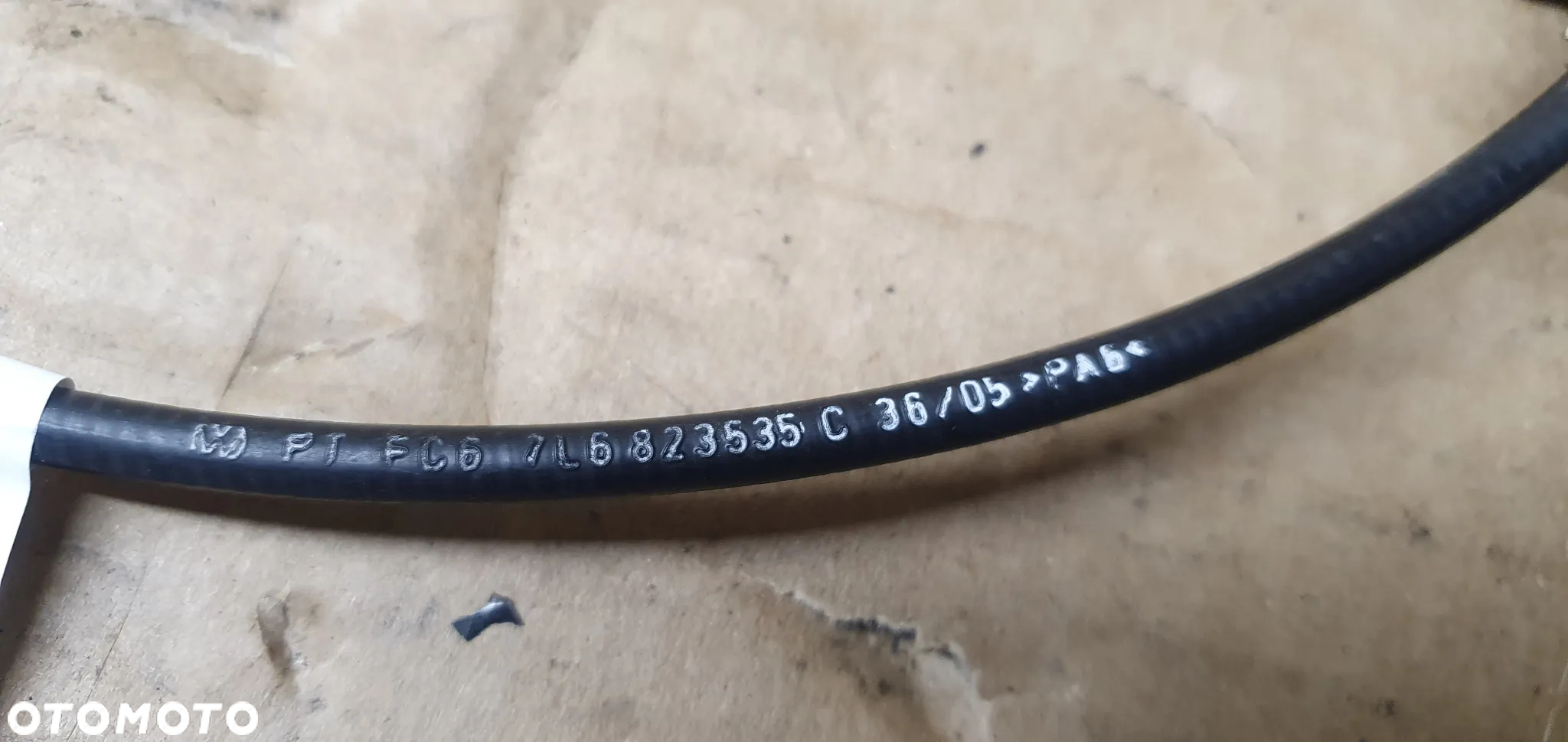 Linka cięgno otwierania maski VW Touareg 7L6823535C - 6