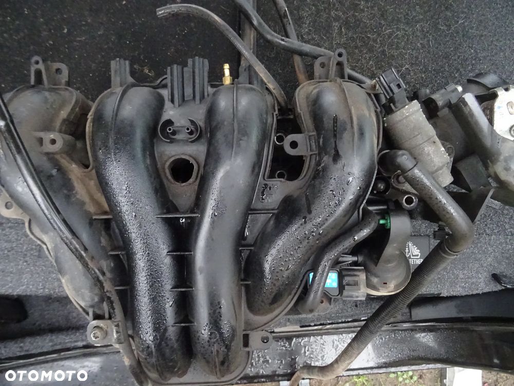 MAZDA TRIBUTE 2,3 150KM LIFT KOLEKTOR SSACY DOLOTOWY ORYGINal czesci