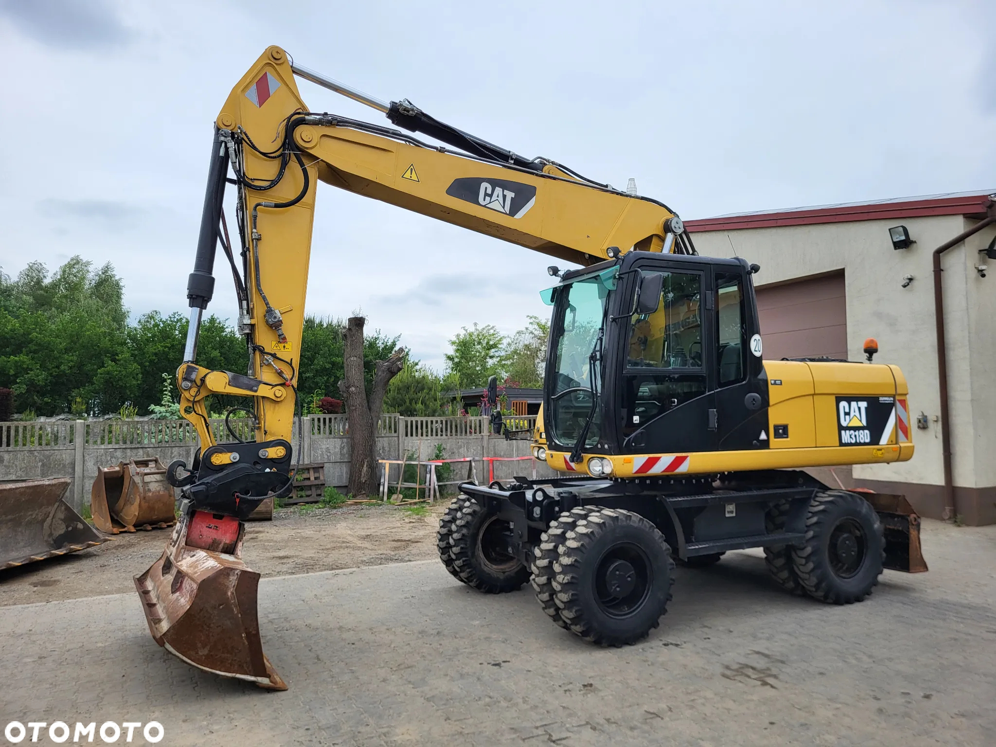 Caterpillar M 318D / z Niemiec / stan idealny / - 2