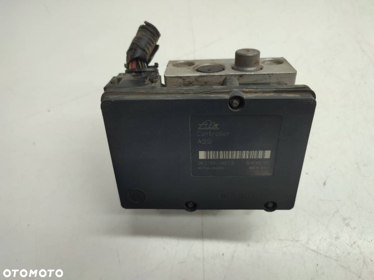 POMPA HAMULCOWA ABS NISSAN NAVARA III D40 2.5 DCI 47660EB33A - 1